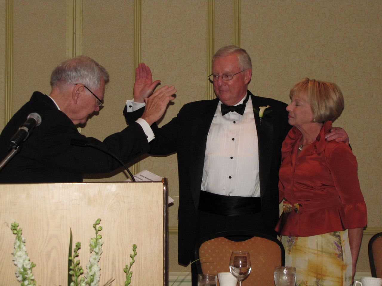 President O'Brien is sworn in by Illinois Supreme Court Chief Justice Thomas Fitzgerald as Karen O'Brien looks on.