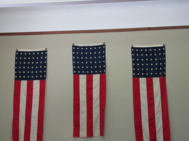 Three flags from the celebration still fly in the Circuit Clerk's office.