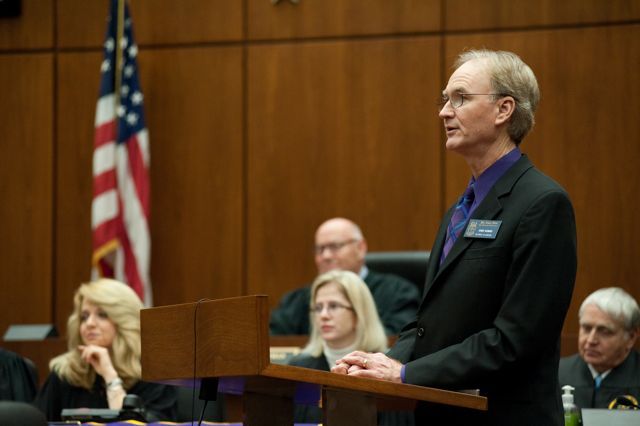 Phi Alpha Delta District XI Justice John Norris welcomes the initiates to the fraternity.