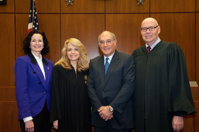 Fraternity initiates Jayne Reardon (left), Executive Director of the Illinois Supreme Court's Commission on Professionalism and Mark Hassakis (2nd from right), President-Elect of the Illinois State Bar Association, are congratulated by Michele Jochner, Chicago Alumni Chapter Justice and Chief Judge James F. Holderman, Honorary Board Chair of the Chicago Alumni Chapter. 
