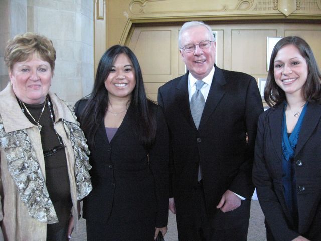 Click to enlarge: Justice Susan F. Hutchinson, law student Nhu, ISBA President John O'Brien and law student Jamie Esser