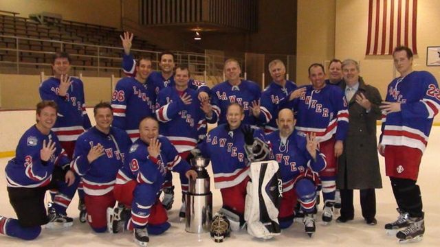 Celebrating their fourth consecutive Master Hockey League championship, the lawyers hockey team, with Master's Cup in hand, pose for their victory photograph. Back row, left to right: Nicholas Labun, Ronald Kalish, Ryan Chiaverini, Michael B. Quigley, Thaddeus S. Machnik, Lowell D. Snorf, III, Michael B. Goldberg, Patrick D. Thompson, John Joseph Muldoon, III, David Vander Ploeg, (front row, left to right) Kevin M. Magnuson, Kent D. Sinson, Steven L. Demitro, Thomas J. Paprocki and David M. Goldman.