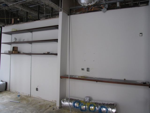 These shelves and partial walls have been removed for more space in the library/conference room.