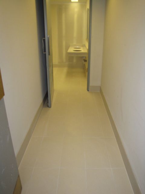 The tile in the women's restroom is nearly complete.