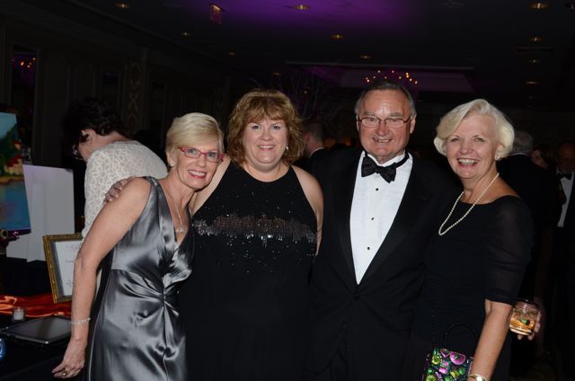 Janet Hassakis, Gala Raffle Co-Chair and ISBA Board member Lisa Nyuli, and Illinois Supreme Court Justice Lloyd Karmeier and his wife, Mary