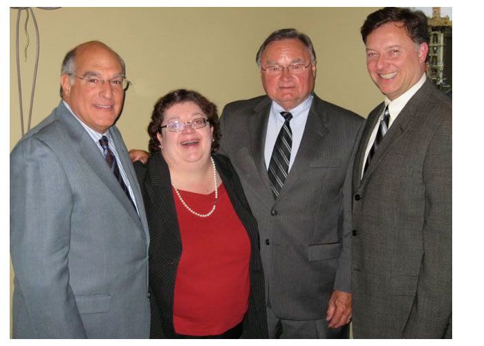 ISBA President Mark D. Hassakis, 3rd Circuit Judge Barbara Crowder, Illinois Supreme Court Justice Lloyd Karmeier, and President-elect John G. Locallo at a reception at Lorenzo's Trattoria on the Hill in St. Louis prior to an ISBA Board of Governors meeting.