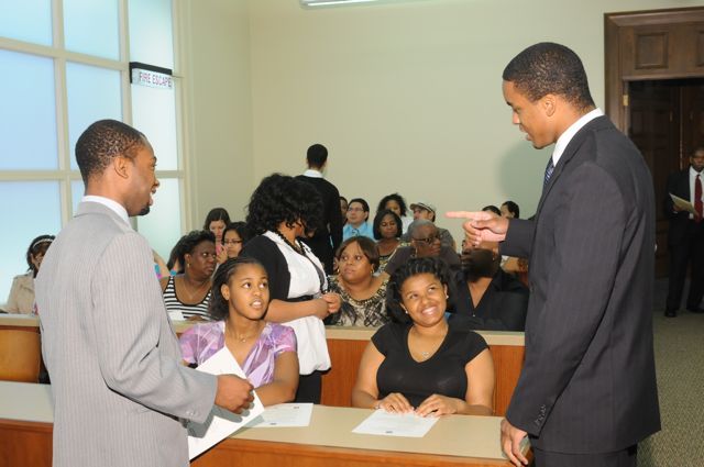 Teachers Tyreese Foreman and Terrance Garmon chat with students
