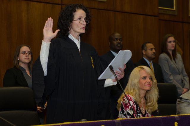 Jayne Reardon administers the oath of initiation 
