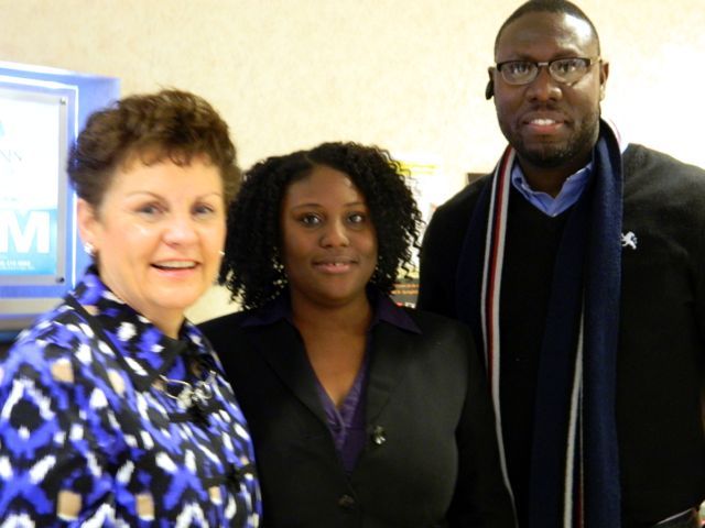 New admittee Yaniece A. McPherson (Champaign) with her husband, Kamal King, and Justice Rita B. Garman