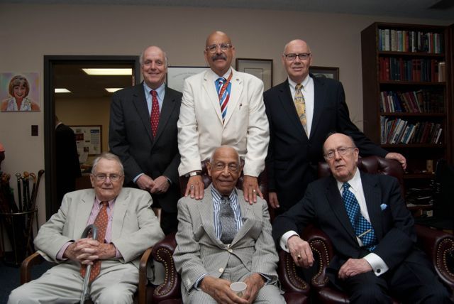Judge Leighton is congratulated by fellow colleagues on the bench.  From Left to Right (back row):  Hon. Wayne R. Andersen (Ret.), U.S. District Court for the Northern District of Illinois; Hon. William H. Hooks, Circuit Court of Cook County and Chair of the event Steering Committee; Hon. James F. Holderman, Chief Judge, United States District Court for the Northern District of Illinois; Hon. Richard D. Cudahy (Ret.), United States Court of Appeals for the Seventh Circuit; Hon. George Leighton; Hon. William J. Bauer, United States Court of Appeals for the Seventh Circuit.
