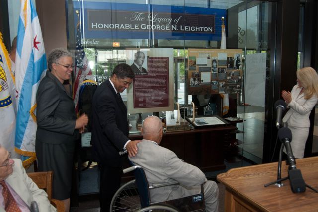 Judge Leighton and all in attendance view the permanent lobby display for the first time.  