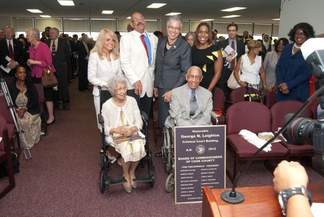 Cook County Board President Toni Preckwinkle (third from right) and event Steering Committee Co-Chairs Michele Jochner, Hon. William Hooks and Juliana Stratton, congratulate Judge Leighton and his sister. 