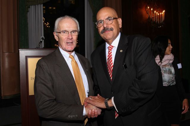 Attorney John Lowrey congratulates awardee Hon. William Hooks. 