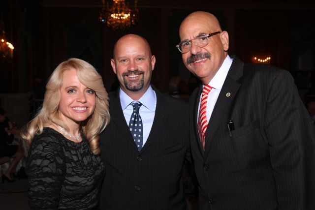 Honorees Michele Jochner and Judge William Hooks visit with Shawn Kasserman (center). 