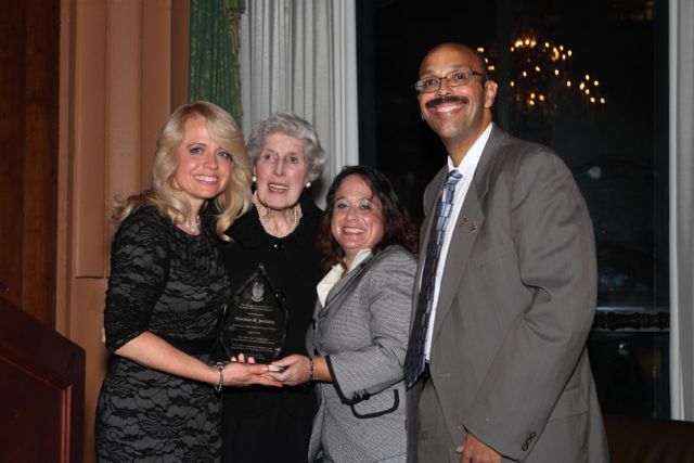 Michele Jochner receives the award from its namesake, Justice Mary Ann G. McMorrow (Ret.), Event Chair Deidre Baumann, and  Pierre W. Priestley, Justice of the Chicago Alumni Chapter of Phi Alpha Delta. 