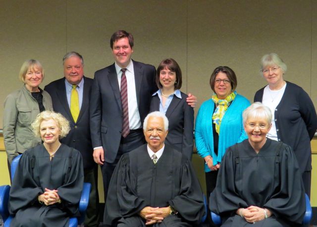 New admittees and married couple John Christopher Fitzpatrick and Jessica Tagatz (rear, middle) Fitzpatrick with family and Illinois Supreme Court Justices Anne Burke, Charles Freeman and Mary Jane Theis. 