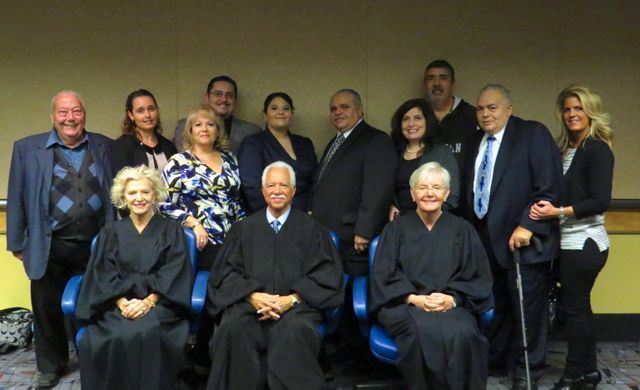 New admittee Joanna Panici and family with Justices Burke, Freeman and Theis.