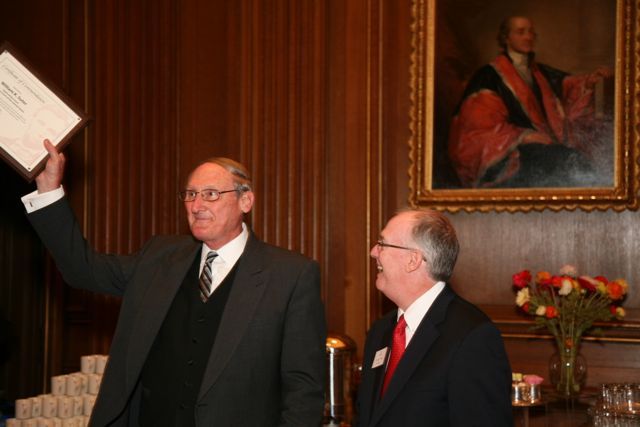 ISBA President John Thies presents a plaque to retiring Supreme Court Clerk William Suter