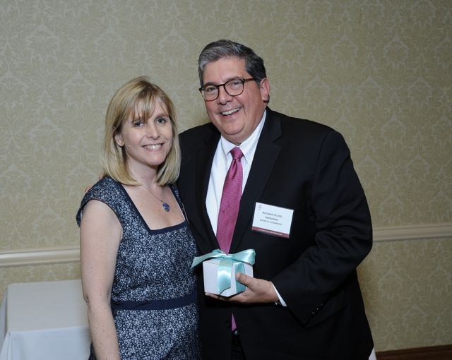 ISBA President Richard D. Felice accepts the Executive Director's Award from LAP Executive Director Robin Belleau