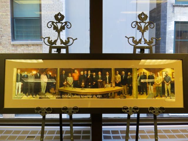 President Umberto S. Davi presented a portrait from a 2001 Board meeting held in Taylorville during the presidency of J. Timothy Eaton. 