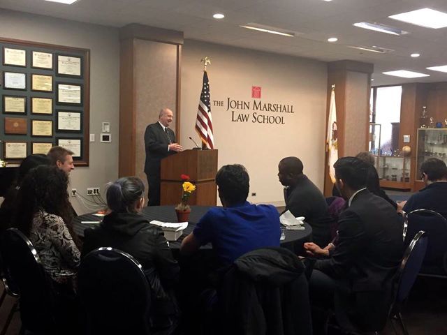 Presiding Judge of the Law Division in the Cook County Circuit Court - the Honorable James Flannery Speaking to the audience. 