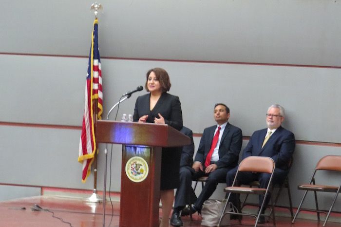 Claudia Castro delivers a speech to new admittees