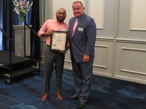 Cory White, Board of Governors Award recipient, and President Russell Hartigan
