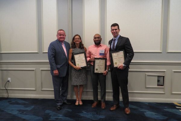 President Russell Hartigan, Jennifer Rosato Perea, Cory White, and George Schoenbeck, III
