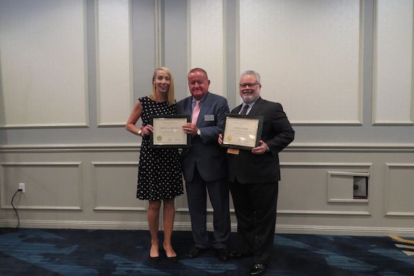 Jessica Hegarty, President Russell Hartigan, and Curtis Ross
