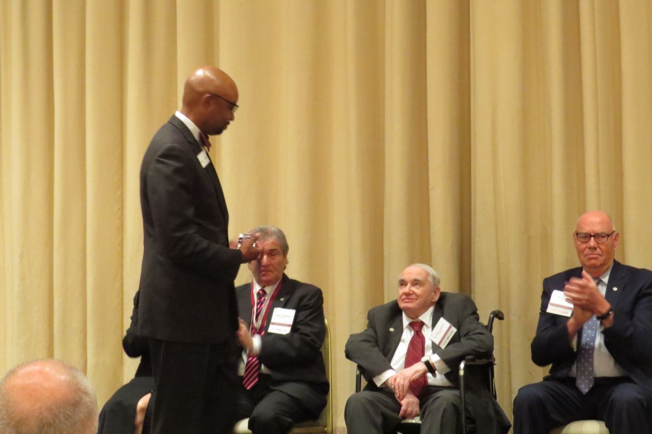 Vincent Cornelius presents Marshall Hartman his award
