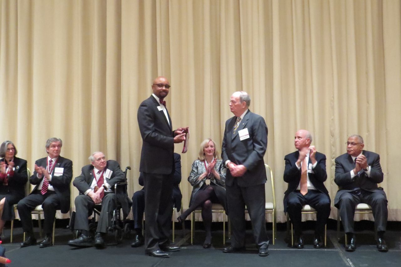Vincent Cornelius presents Nicholas Motherway his award
