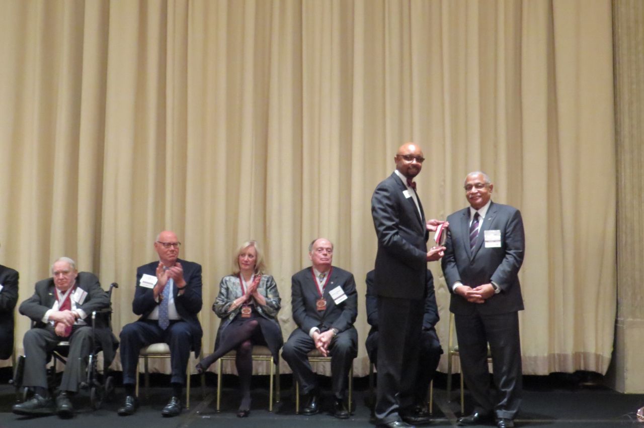 Vincent Cornelius presents Larry Rogers his award
