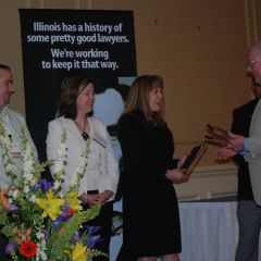 President-elect John O'Brien presents the John C. McAndrews Pro Bono Service Award