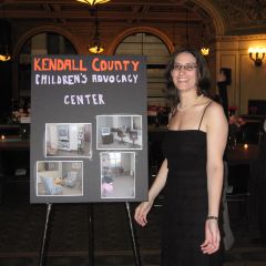 Summer Soiree co-chair Debra Liss with Kendall County charity chart