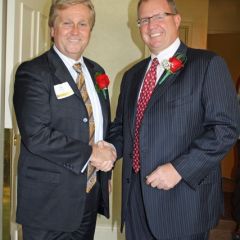 Scott Barber, outgoing president of the Northwest Suburban Bar Association (left), congratulates new President Lee F. DeWald.