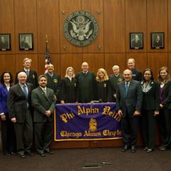 The Chicago Alumni Chapter recently initiated 8 prominent attorneys who pledged to uphold the fraternity's mission of service to the student, the school, the profession and the community. The new initiates are in the front row, l to r:  Daniel Cotter; Jayne Reardon; Edward Andersen; Enrique Abraham, President of the Puerto Rican Bar Association; Mark Hassakis, President-Elect of the Illinois State Bar Association; Yolaine Dauphin; Laura Milnichuk; Alfred Swanson, Jr. Back row, l to r: Kevin Hull, Pierre Priestley, Nicole Kopinski, Chief Judge Holderman, Michele Jochner, Bob Downs, John Norris.