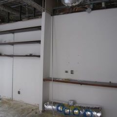 These shelves and partial walls have been removed for more space in the library/conference room.