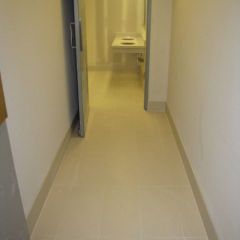 The tile in the women's restroom is nearly complete.