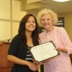 Cheyenne Quinones receives a Certificate of Completion from Justice Burke
