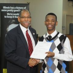 Dean Rory Smith presents a Moot Court award to David McNeal