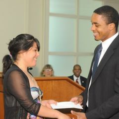 Teacher Terrance Garmon presents the Lincoln Award ($150 cash, $5,000 John Marshall tuition waiver) to Esperanza Gaytan