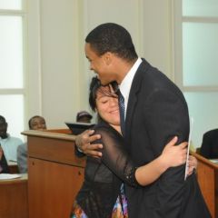 Teacher Terrance Garmon gets a hug from Lincoln Award winner Esperanza Gaytan