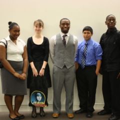 Teacher Tyrese Foreman with a group of students in the Daley Center.