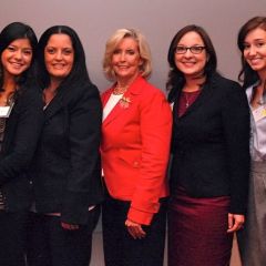 Noemy Garcia (far Left) and Emily Masalski (second from right) of the ISBA's Women and the Law Committee greet Lilly Ledbetter
