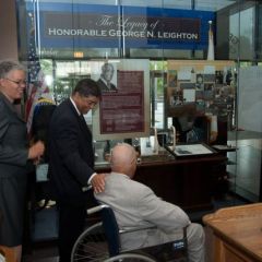 Judge Leighton and all in attendance view the permanent lobby display for the first time.  