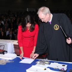 Cook County State's Attorney Anita Alvarez signs the membership role, as District XI Justice John K. Norris looks on.