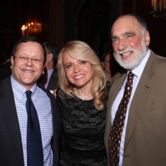Michele Jochner (center) is congratulated by Jonathan Lowe and Warren Lupel.
