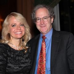 Michele Jochner is congratulated by Dean Gregory Mark of DePaul University College of Law, her alma mater.