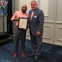 Cory White, Board of Governors Award recipient, and President Russell Hartigan
