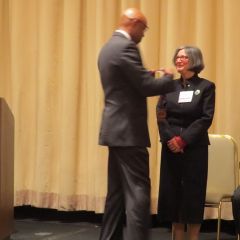 Vincent Cornelius awards Patricia Bronte with her award
